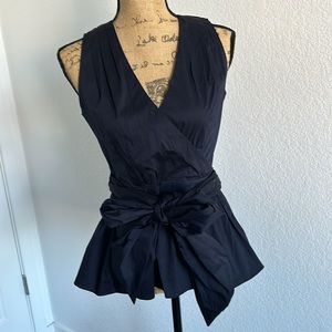 Cute top , beautiful cut and bow detail